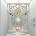 The Om - green mother of pearl mandala with Om in center on Swiss white marble mandir with hanging temple bells - Stone plus india