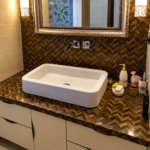 Golden and Blue Tigers Eye Herringbone Bathroom Design