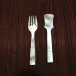opulent homes mother of pearl spoon and fork.