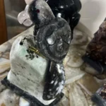 The Midnight Monarch - Obsidian Bird on White Marble